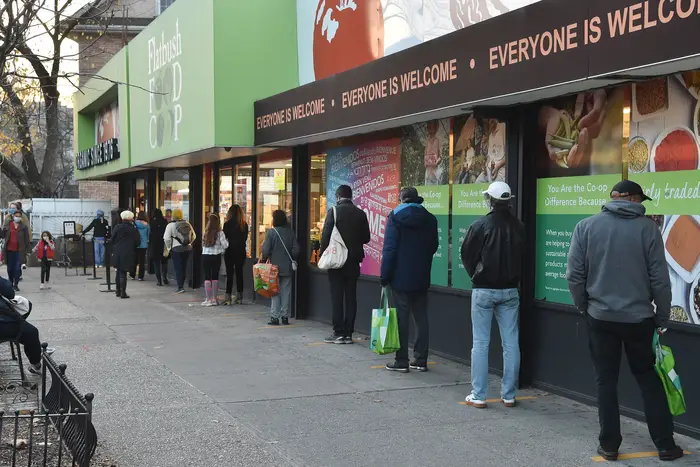 People line up outside the Food CoOp in Flatbush on Wednesday.